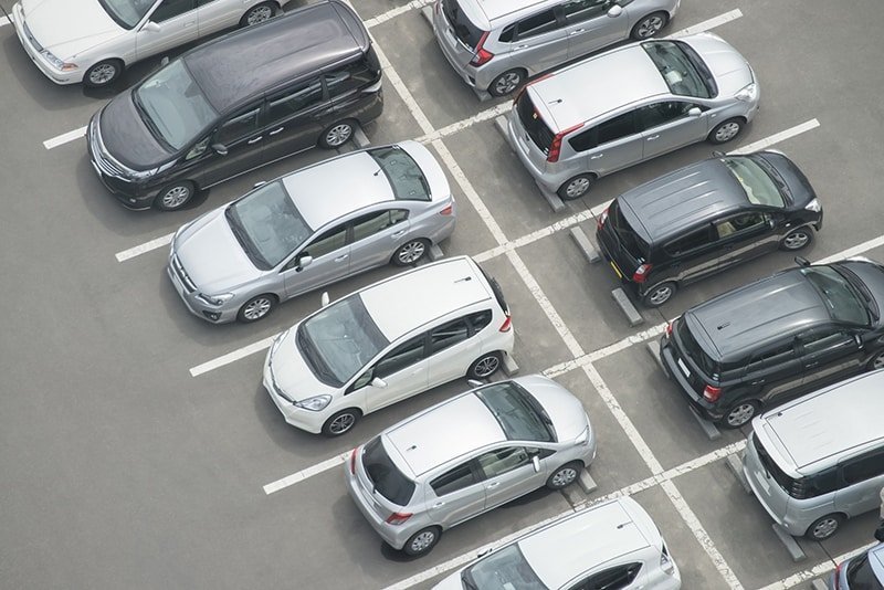 A bunch of cars parked in the lot