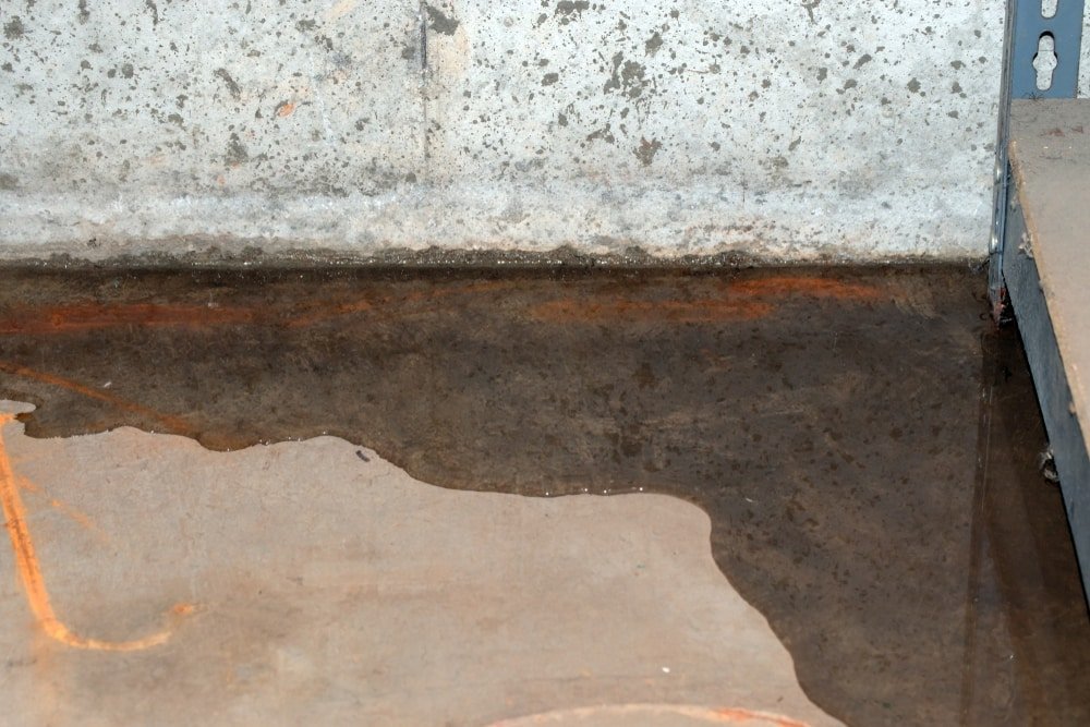 A concrete slab with water leaking from it.