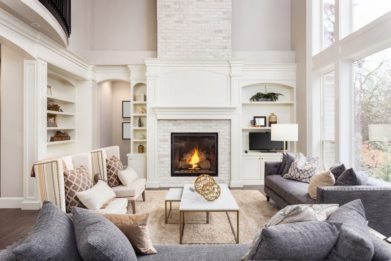 A living room with two couches and a fireplace