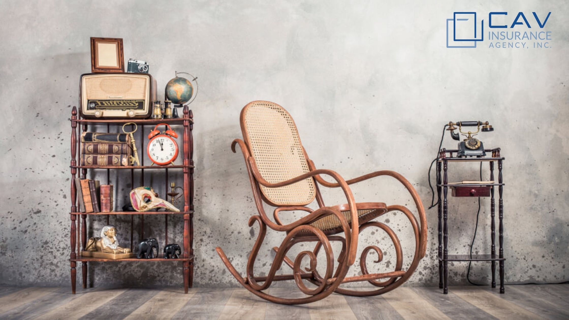 A rocking chair sitting in front of a wall.