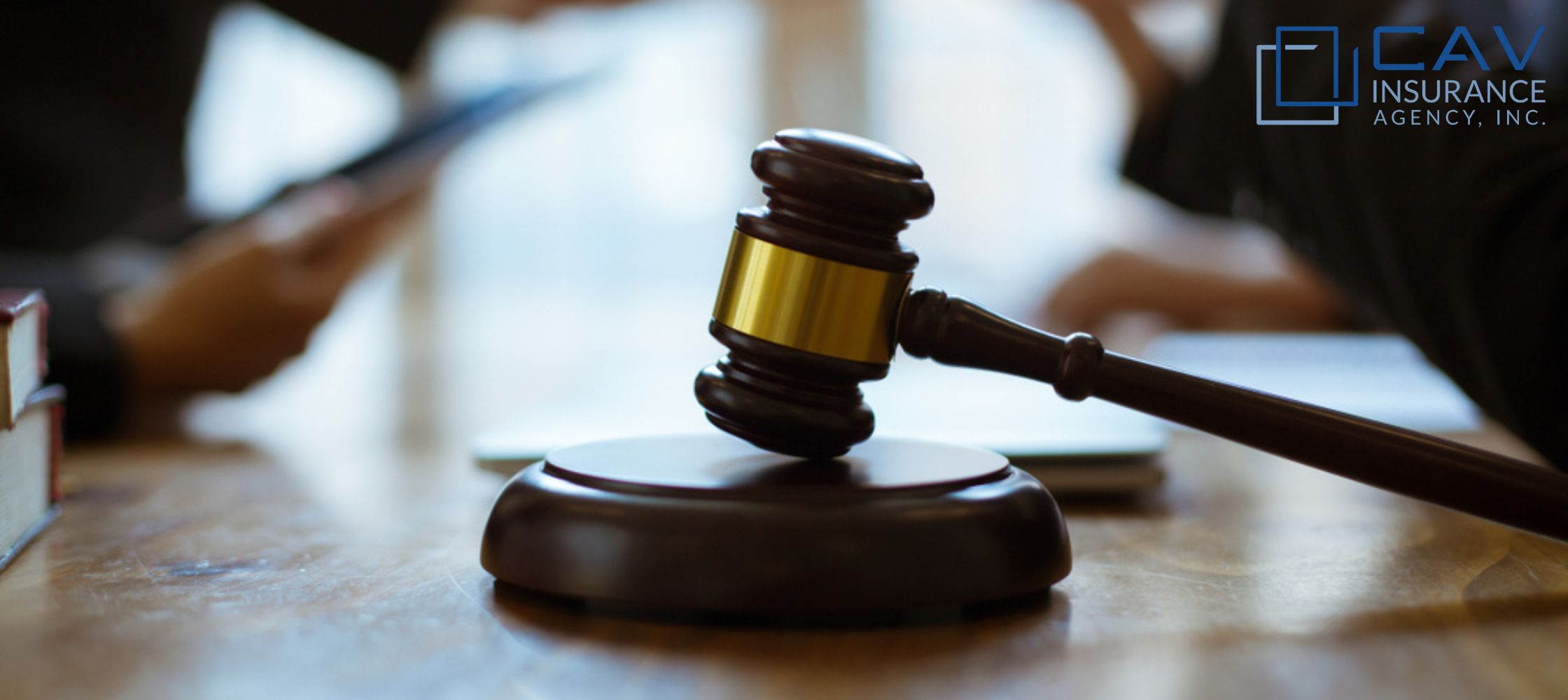 A wooden gavel sitting on top of a table.