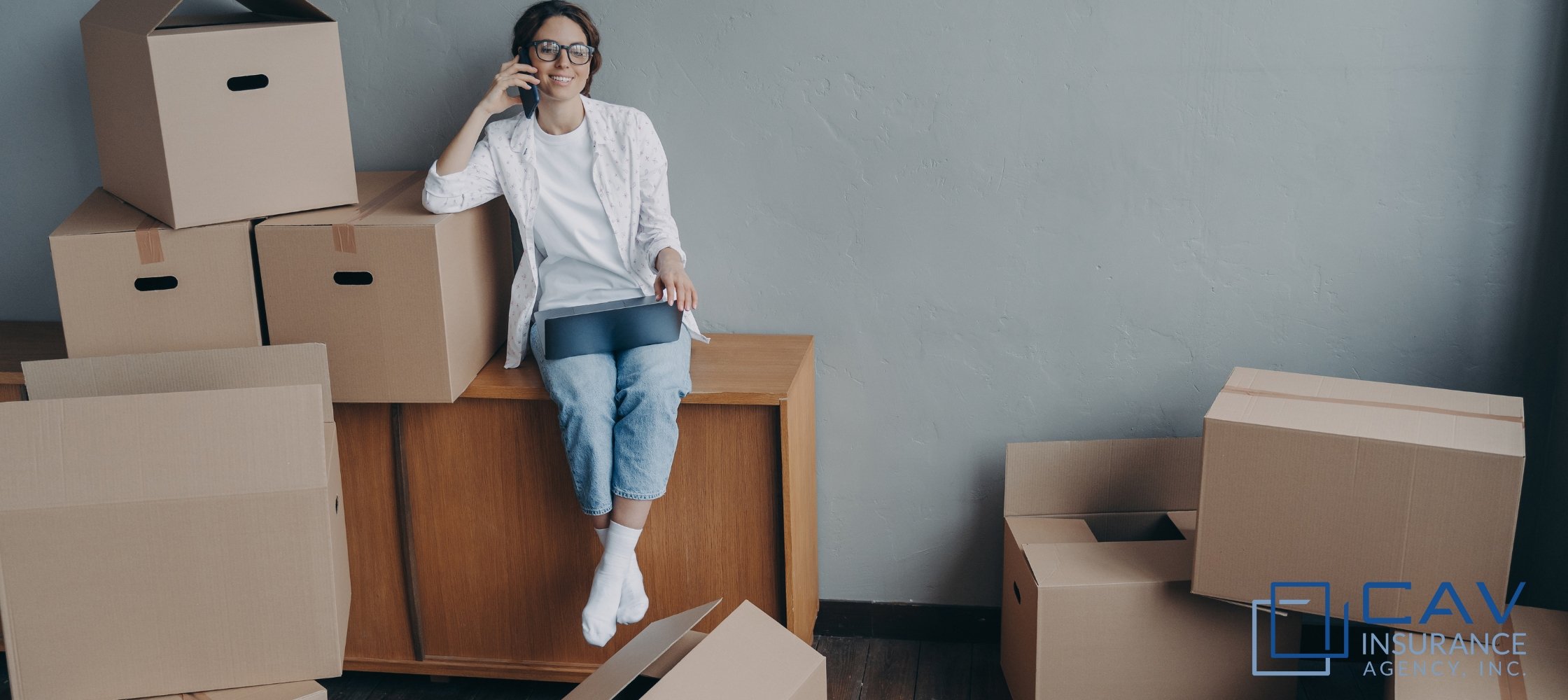 A woman sitting on top of a wooden box.